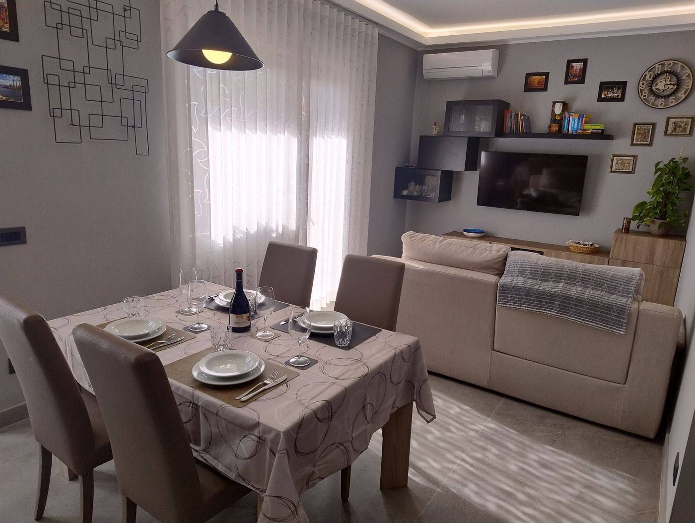 Your New Holiday Home, living room with sofa and set dining table
