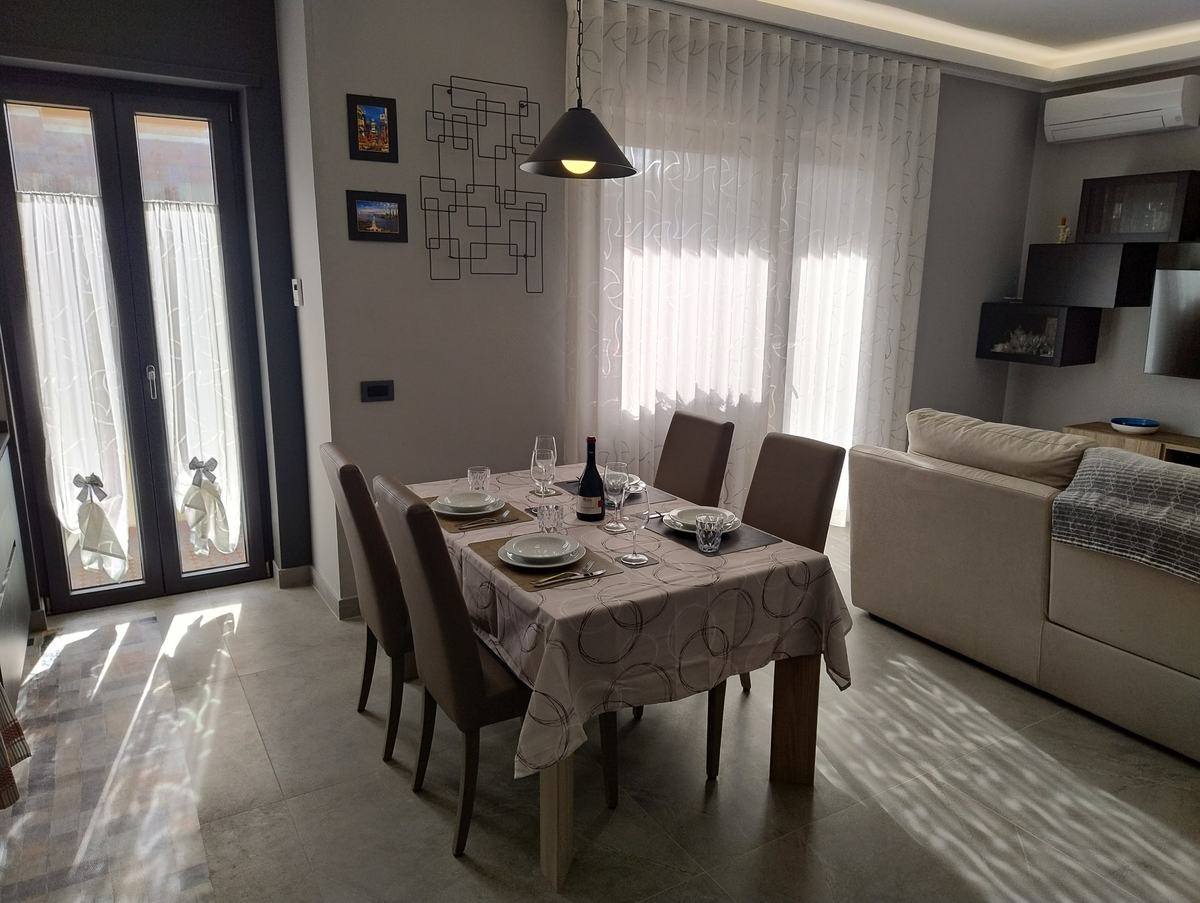 Dining table for four next to the terrace door