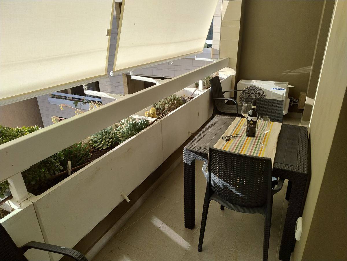 Balcony with table and chairs